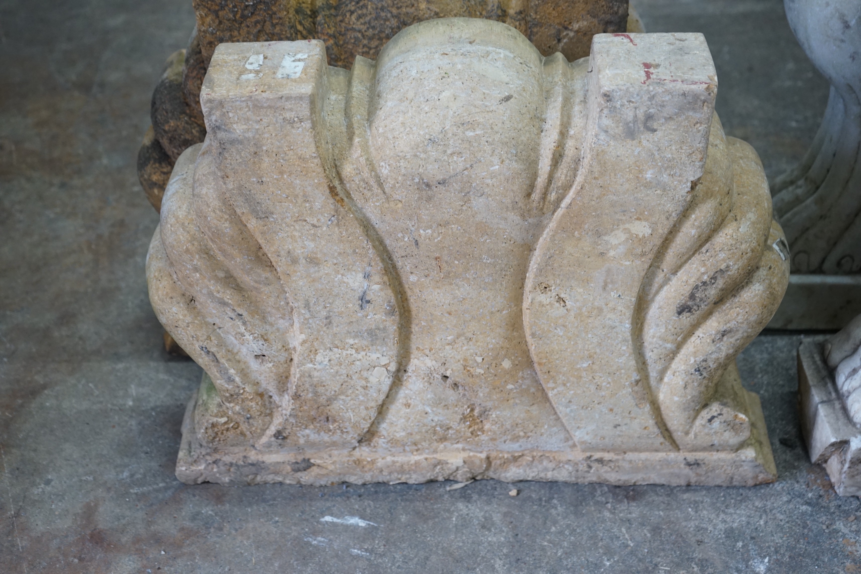 A pair of carved stone scallop shell mounts, width 60cm, height 47cm